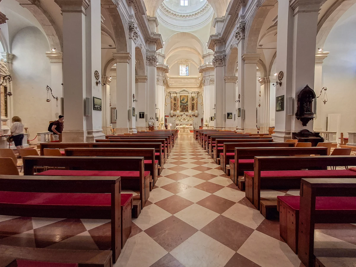 The elegant Baroque interior and main altar inside the Cathedral of the Assumption