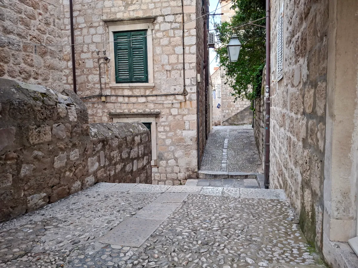 A charming stone alley in the southern section of Dubrovnik Old Town near the Rupe Museum