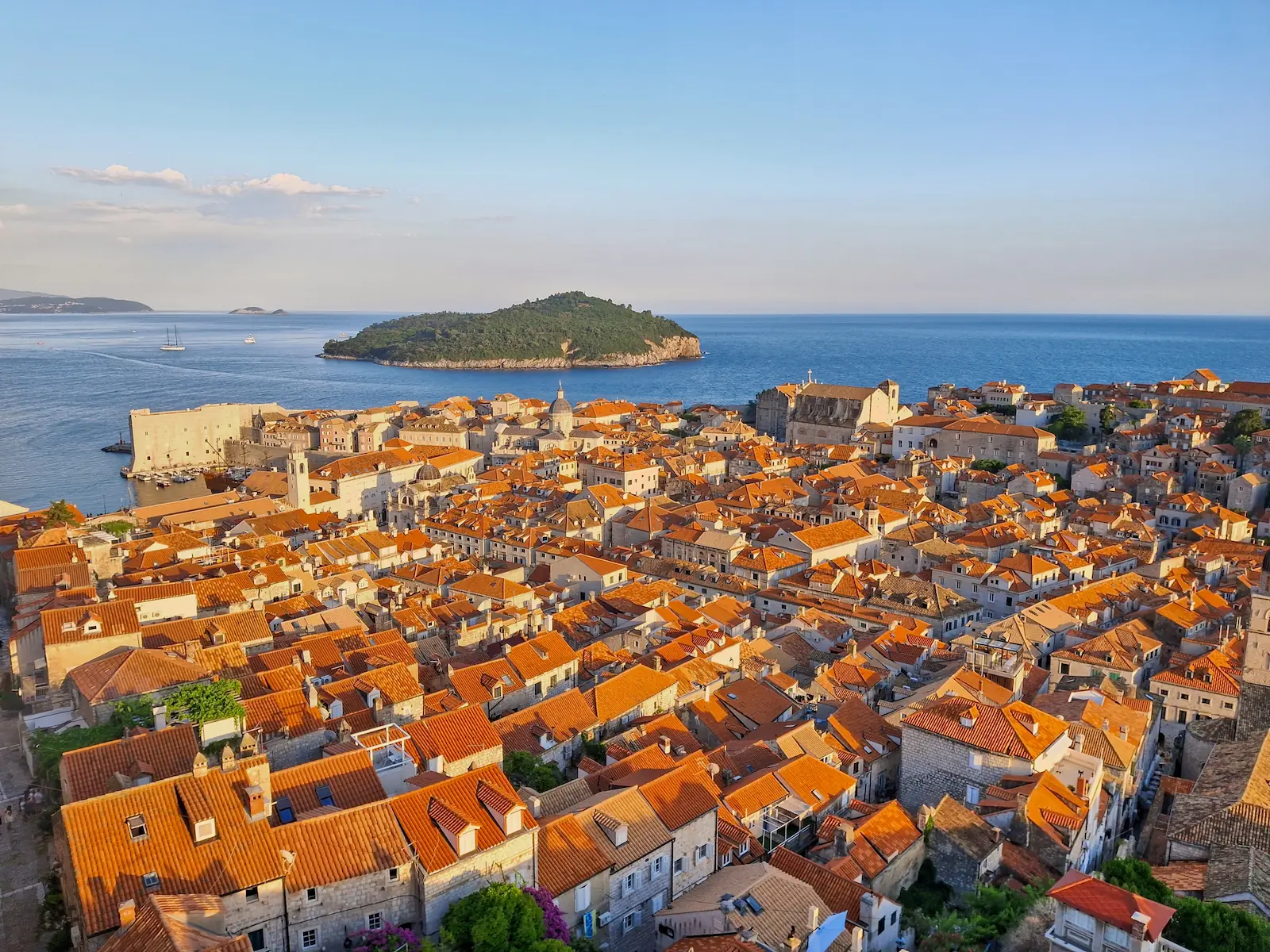 View of Dubrovnik Old Town from Minčeta Tower bathed in warm, evenly lit pre-sunset light