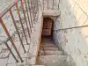 Upper staircase descending from the terrace level of Bokar Fortress toward the lower sections of the fortress