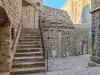 Bottom-up view of the terrace stairs with the lower courtyard and entrance gate of Bokar Fortress beside them
