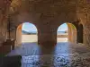 Interior view looking through double stone arches on the middle terrace of Fort Lovrijenac