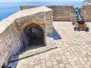 Top terrace entrance of Fort Lovrijenac with a small side cannon in the foreground
