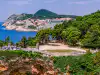 Distant wide view looking towards the Gradac Park entrance and parking lot from St. Lawrence Fortress