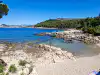 Quiet pebble beach along the rocky coast of Lokrum Island