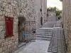 Stone pathway on Margarita Street with the Buža Bar entrance visible to the side