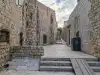 Narrow stone pathway on Margarita Street just after St. Margarita Church leading toward the Buža Bar entrance