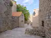 View along Margarita Street with the courtyard and St. Margarita Church visible