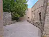 View across the stone courtyard on Margarita Street near St. Margarita Church and the Dubrovnik City Walls