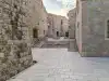 Stone steps on Margarita Street beside St. Margarita Church leading toward the Buža Bar area