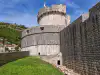 Bottom-up view of the towering outer wall of Minčeta Tower near its lower exit door