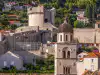 Zoomed-in view from the seaside walls showing Minčeta Tower aligned just next to the Franciscan Monastery bell tower
