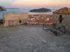 Panoramic view from the top terrace of Minčeta Tower showing the stone floor, old town rooftops, and Lokrum Island