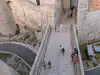 Overhead view from the city walls looking straight down at Revelin Bridge