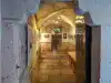 View looking into the basement corridor displaying Homeland War photography inside the Rector's Palace