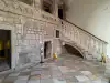 Ground-level view of the smaller staircase and passage entrance on the prison side of the Rector's Palace courtyard