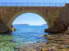 Sea horizon framed by arched underside of Trsteno bridge separating Koločep and Lopud islands