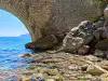 Sea level view underneath stone Trsteno bridge looking inland toward descending stairs