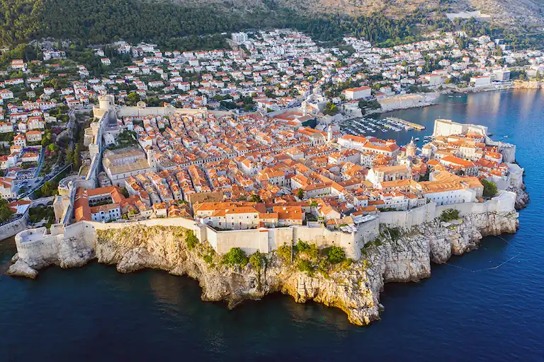 A panoramic aerial view of Dubrovnik’s Old Town surrounded by medieval walls and fortresses